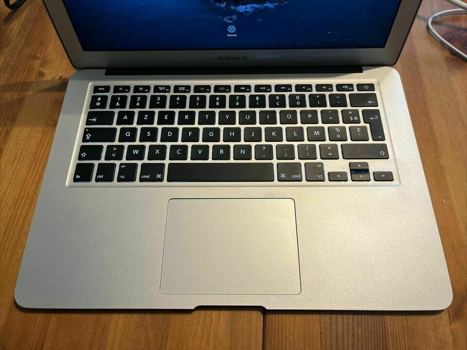 A picture of a 2012 MacBook Air with a non-American keyboard
